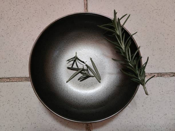 istock Rosemary on black saucer 1301942238