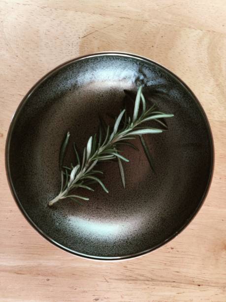 istock A rosemary in a black saucer 1301942243