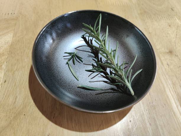istock A rosemary in a black saucer 1301942244