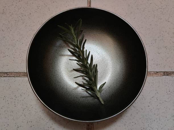 istock Rosemary on black saucer 1301942252