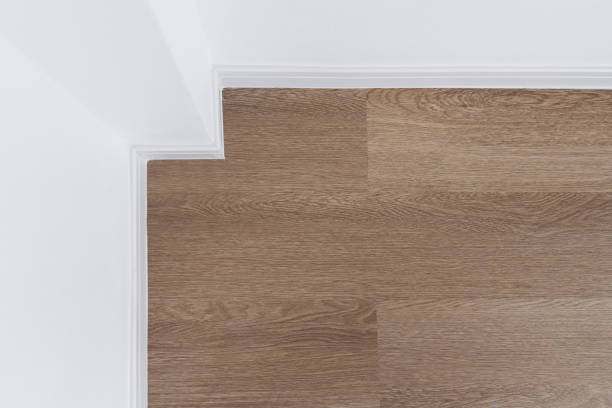 istock wood floor with white wall 1301945289