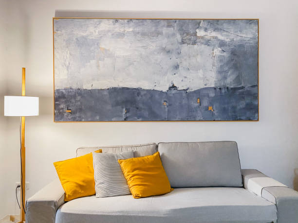 living room with sofa and yellow cushions