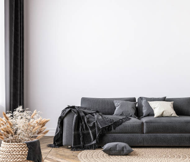 wall mockup in bright living room design, dark sofa in farmhouse interior style stock photo