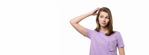 istock young pretty woman thinking and wonder. Place for your text 1301947555