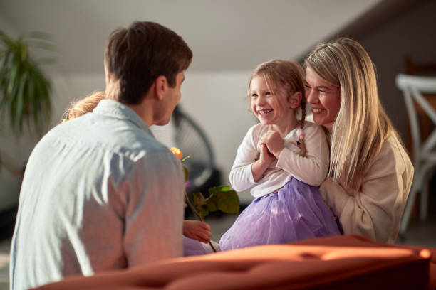 istock Happy parents playing together with their chidren 1301949817