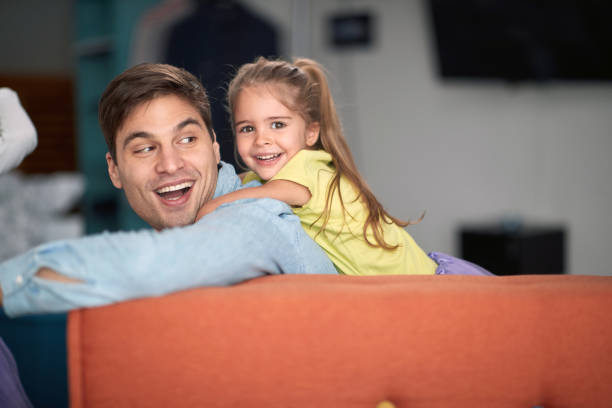 istock Joyful father and daughter playing together 1301951933