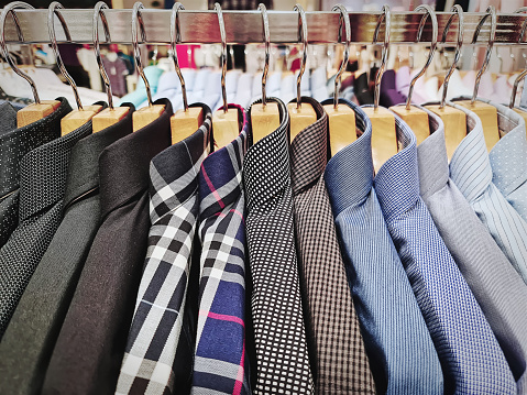 Collection of Men's Formal Shirts Hanging on the Rack