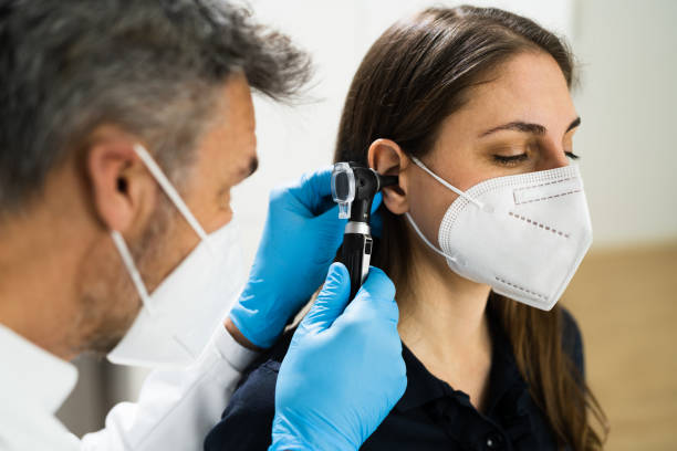 istock Otolaryngology Doctor Examining Patient Ear 1301956352