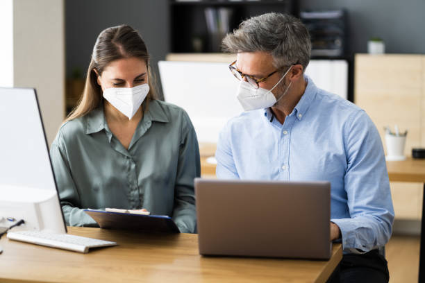 istock Business People Social Distancing Wearing Face Mask 1301956540