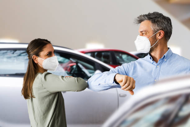 Buyer In Car Dealership Buyer In Car Dealership Wearing Face Mask kn95 face mask photos stock pictures, royalty-free photos & images