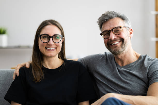 istock Happy Couple Family On Sofa 1301956649