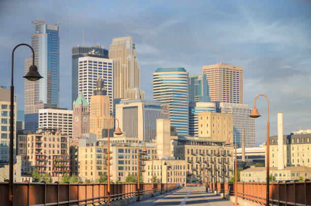 Bridge into the city of Minneapolis downtown area. Sunlight on skyscrapers