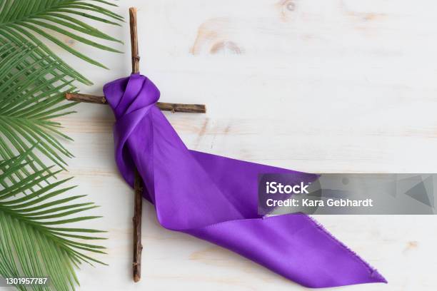 Wood Cross With Purple Ribbon And Palm Leaves Stock Photo - Download Image Now - Lent, Palm Sunday, Easter