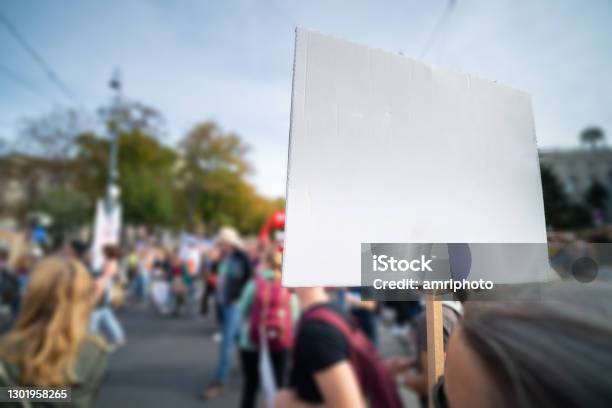 People Protesting On Street Empty Sign With Place For Your Text Stock Photo - Download Image Now