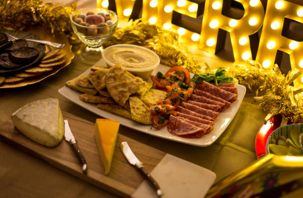 istock Cheese plate Holiday food celebration with marquee lights 1301958928