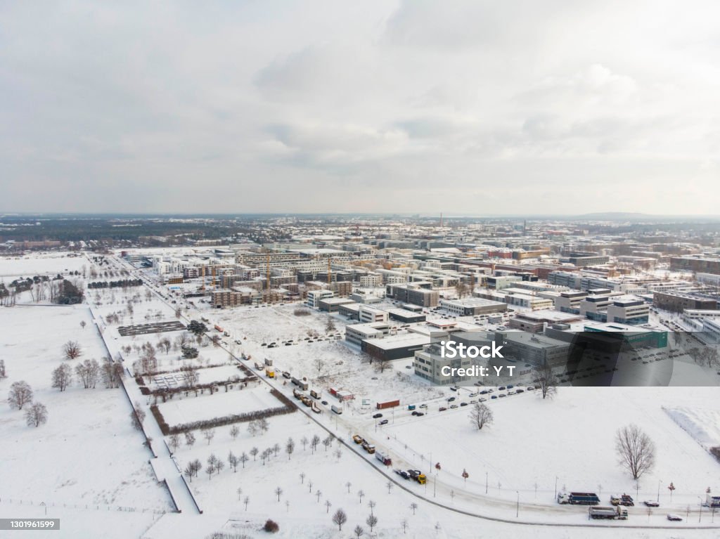 Aerial photo of snowfall around Berlin Adlershof Cold waves reach Germany. It heavily snows in Berlin. Drone shots show how Berlin Adlershof look like. City Stock Photo