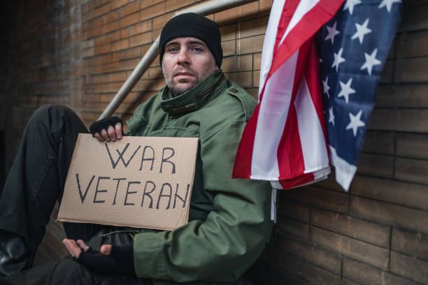 istock Desperate war veteran begging on the street 1301961943
