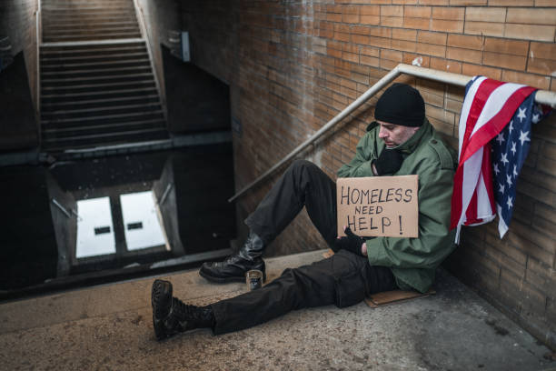 istock Freezing army veteran begging on the street 1301962696
