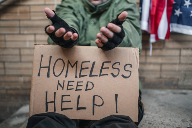 istock Homeless veteran begging for help on the street 1301963599