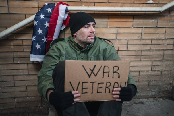 istock Hungry war veteran begging on the street 1301963677