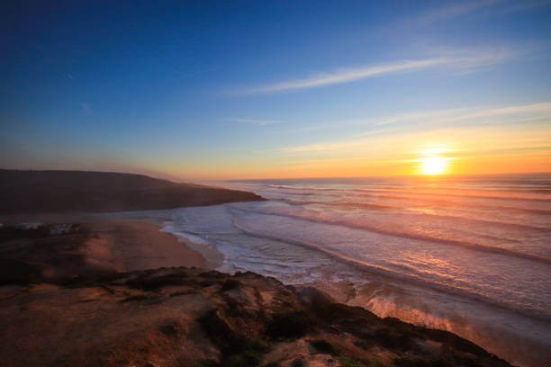 istock Amazing sunset in a beach with the ocean in background. 1301967444