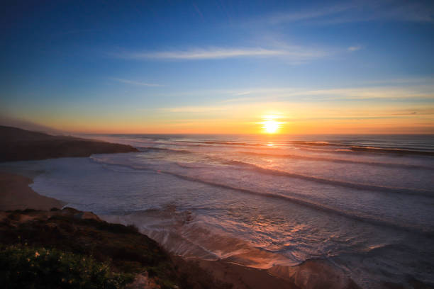 istock Amazing sunset in a beach with the ocean in background. 1301967455
