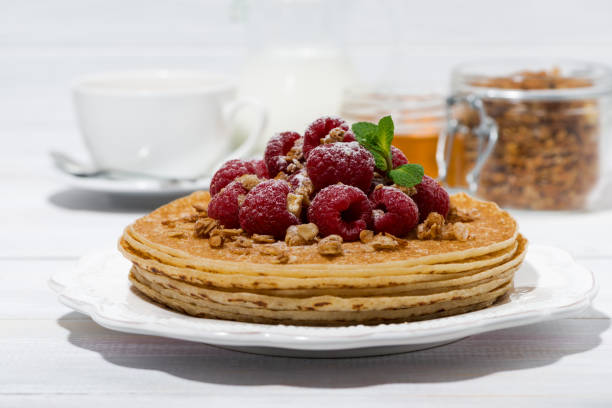 istock traditional pancakes with fresh raspberries for breakfast on wooden table 1301968479