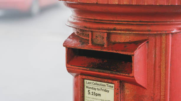 istock Old red post box on a foggy morning 1301970288