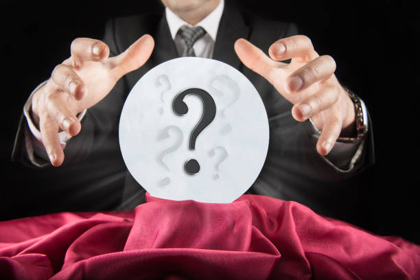 istock Businessman sees question mark in crystal ball 1301972922