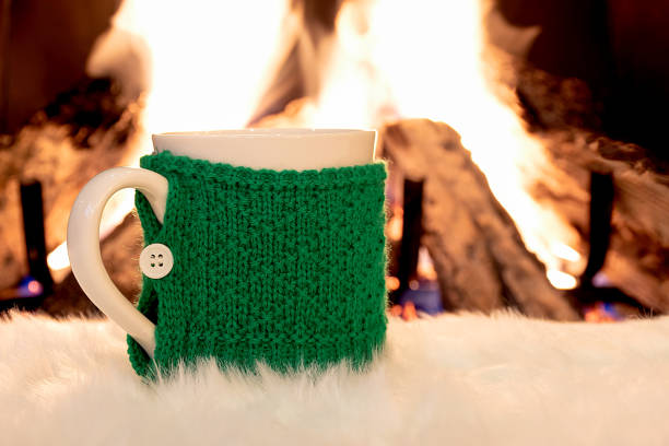 istock knitted sweater on coffee mug by fire 1301975787