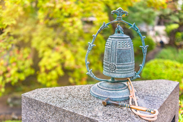 Close up on a small buddhist bronze bell named kobonshou in Tamonji Temple. tokyo, japan - november 10 2020: Close up on a small buddhist bronze bell named kobonshou dedicated to kannon bodhisattva deity of peace or Heiwa-Kannon Bosatsu in the Tamonji Temple. shingon buddhism stock pictures, royalty-free photos & images