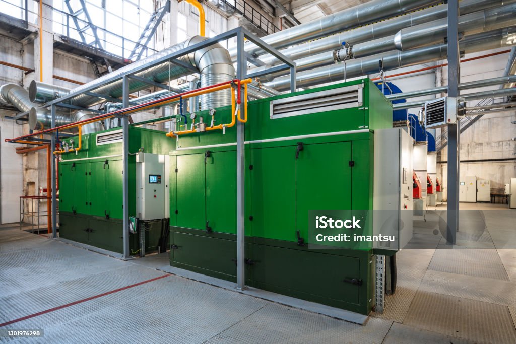Two stationary gas electric generators Two stationary high power gas electric generators  in boiler house Generator Stock Photo
