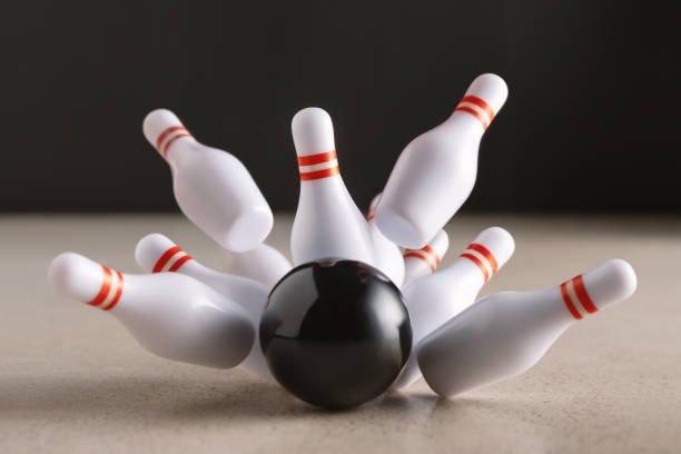 istock Bowling strike hit on dark background. Minimal concept of success and win. 1301977556