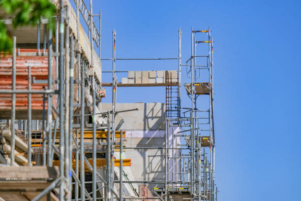 istock Construction site concept: The facade of a large building is completely scaffolded 1301977611