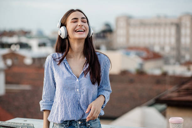istock Young woman enjoying on the rooftop 1301977963