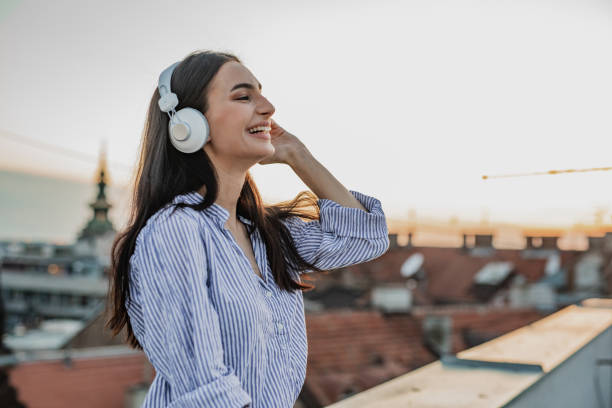 istock Young woman enjoying on the rooftop 1301978003