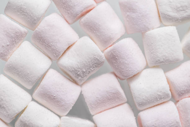 istock Soft white marshmallows, a type of confectionery which is typically made from sugar, water and gelatin whipped to a squishy consistency 1301980139