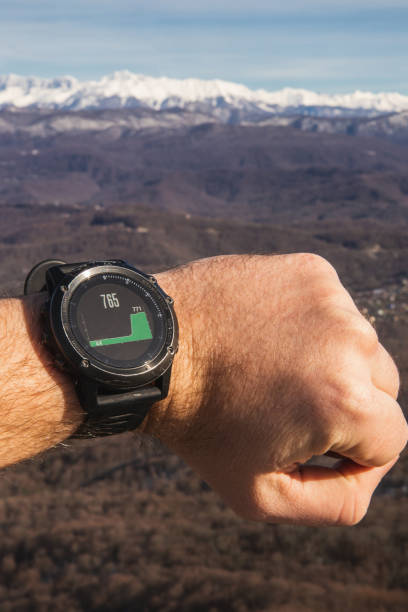 istock Man checks height in mountains with smartwatch 1301980839