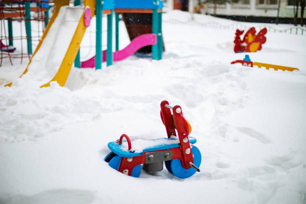 istock Children Playground under the snow 1301980876