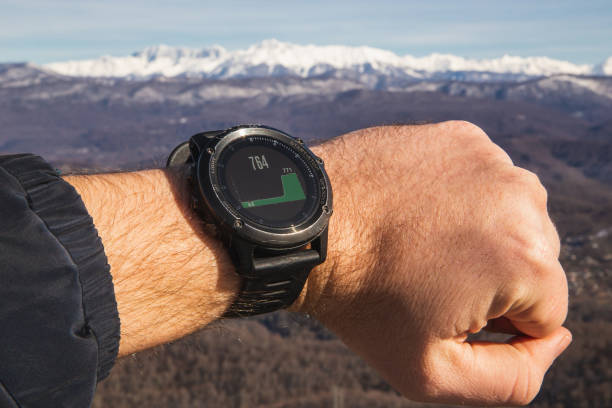 istock Man checks height in mountains with smartwatch 1301980901