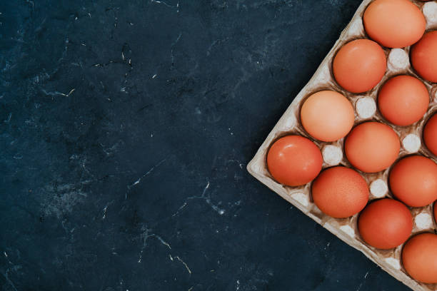 istock Brown chicken eggs in egg carton tray. 1301982646