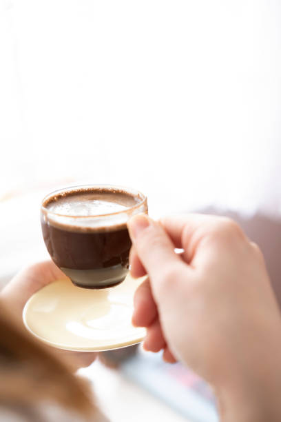 istock Close-up woman hands holding morning turkish coffee. 1301984237