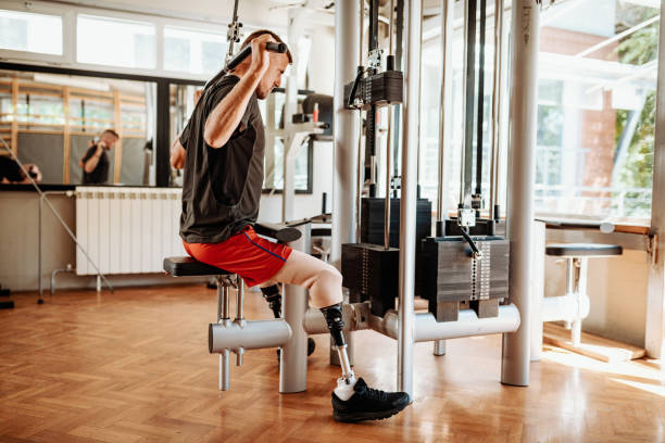 istock Disabled athlete exercising in the gym, lifting weights 1301984825