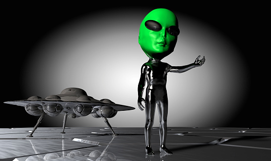 Several green aliens standing in different positions on a black surface. With black eyes and black mouth.