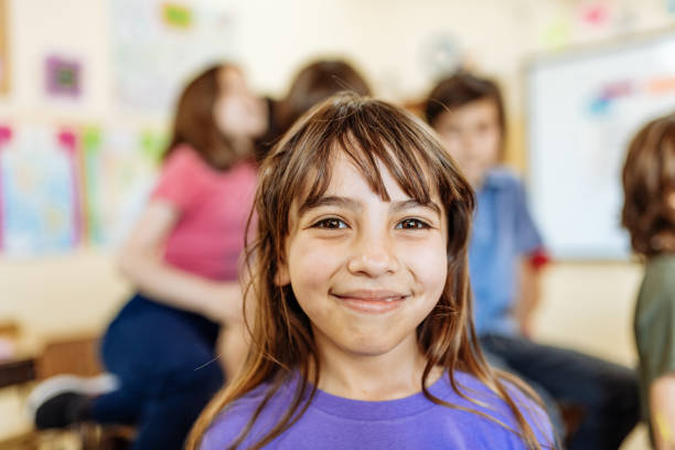 istock Hispanic kids in classroom at school in post-covid-19 world 1301989600