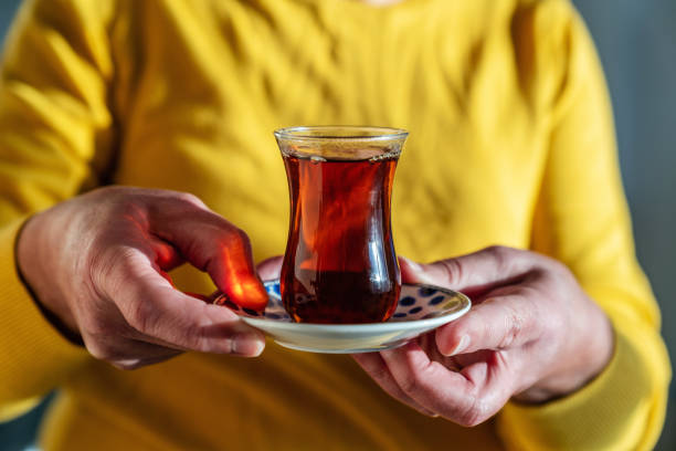 istock Senior woman holding tea 1301993825