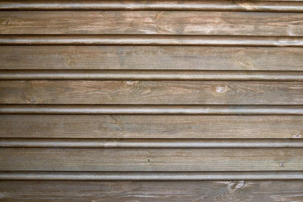 istock the wall is covered with clapboard. wooden background. 1301994937