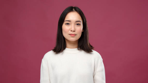 istock Young asian woman smile against marsala copyspace 1301995474