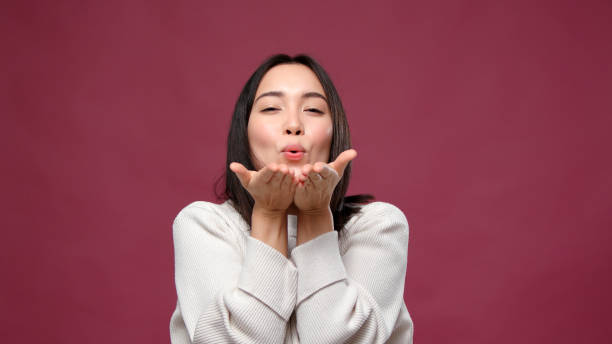 istock Young asian woman fooling around against marsala copyspace 1301995544