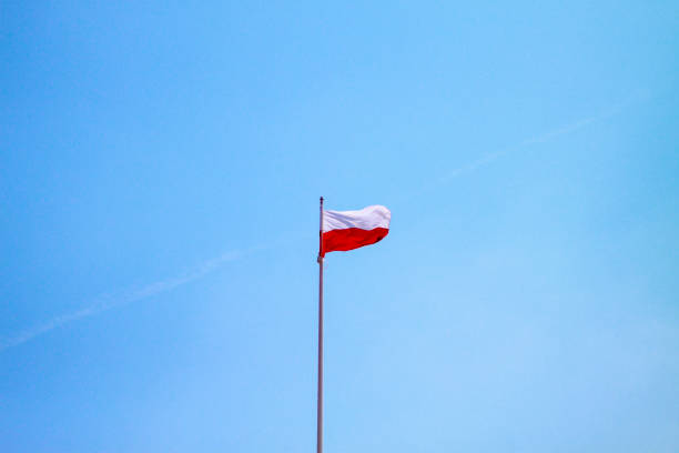 istock Poland flag on a blue sky background 1301998761